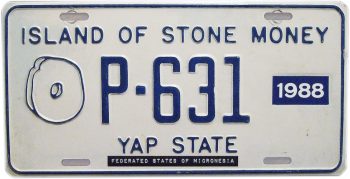 Metal license plate, with a line illustration of an oval object with round hole in its centre: a rai.