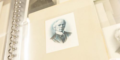 Photo, collage, a photograph and a drawing of an elderly White man in a high collar and old-fashioned suit.